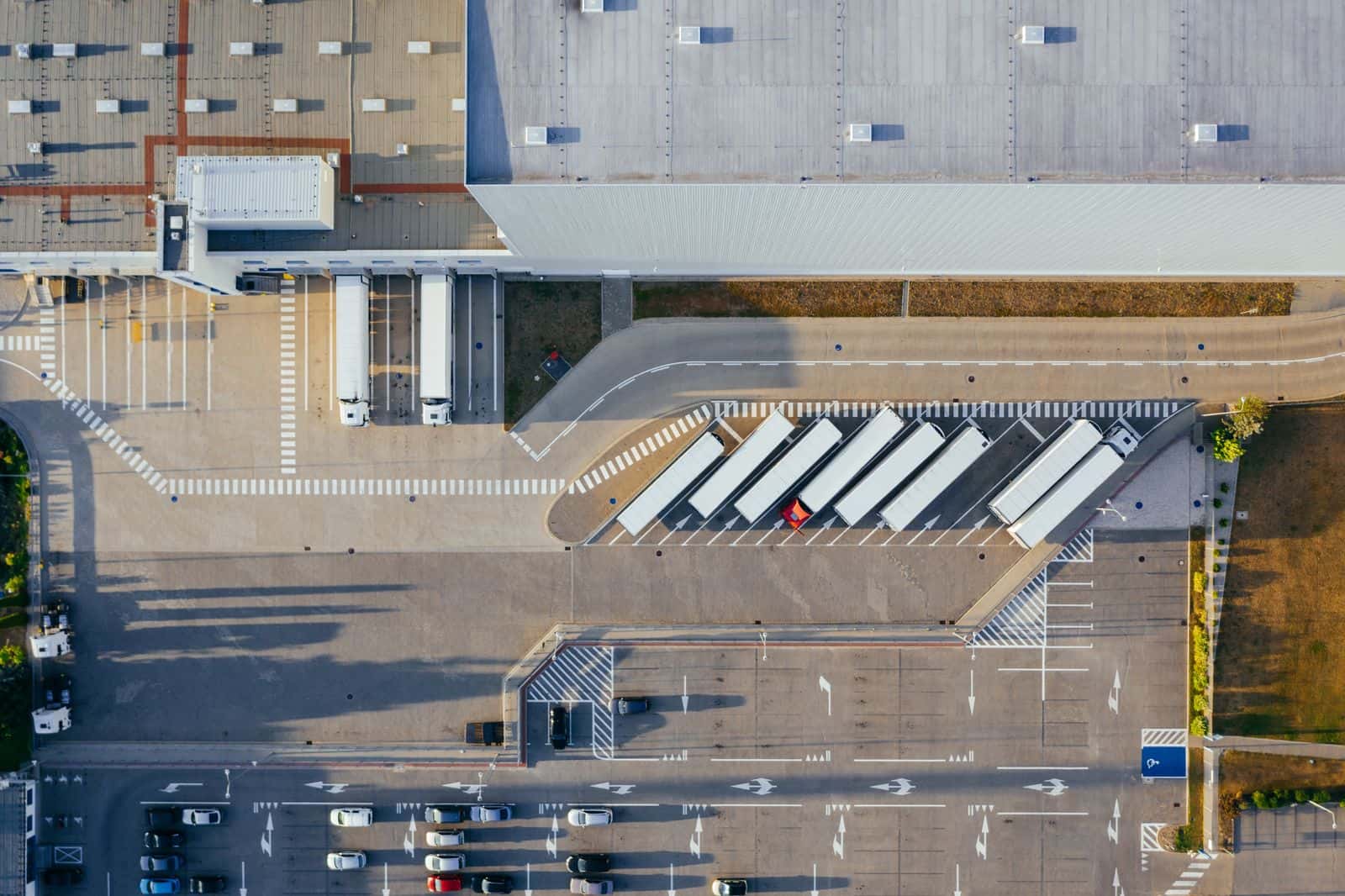 Aerial of a completed cross-dock distribution building with truck courts and trailer parking.